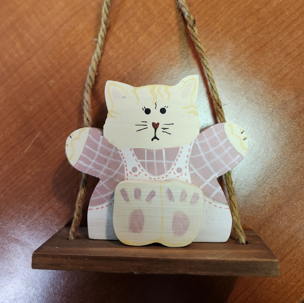 Handmade wood cut kitty cat on swing